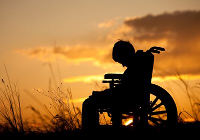 injured boy in wheelchair