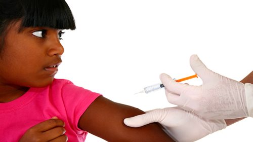 child being vaccinated