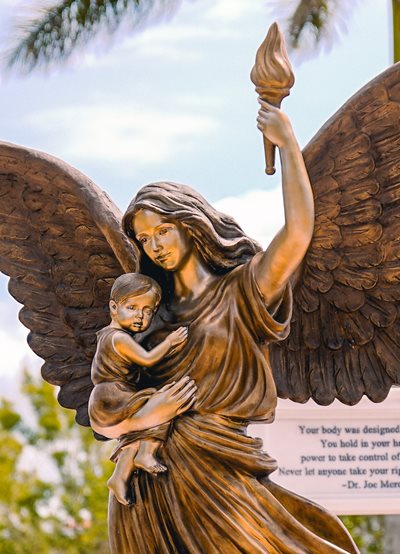 Angel holding child